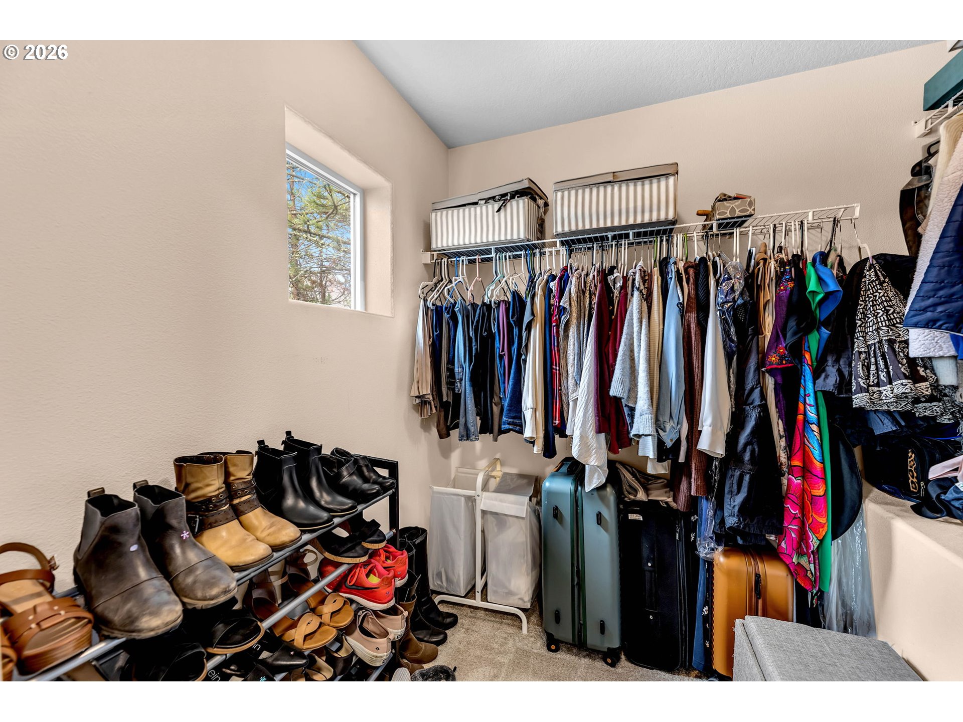 2974 Northwest Kennedy Court, Unit 1 Portland, OR 97229 - Photo 26 of 37 a walk in closet with clothes