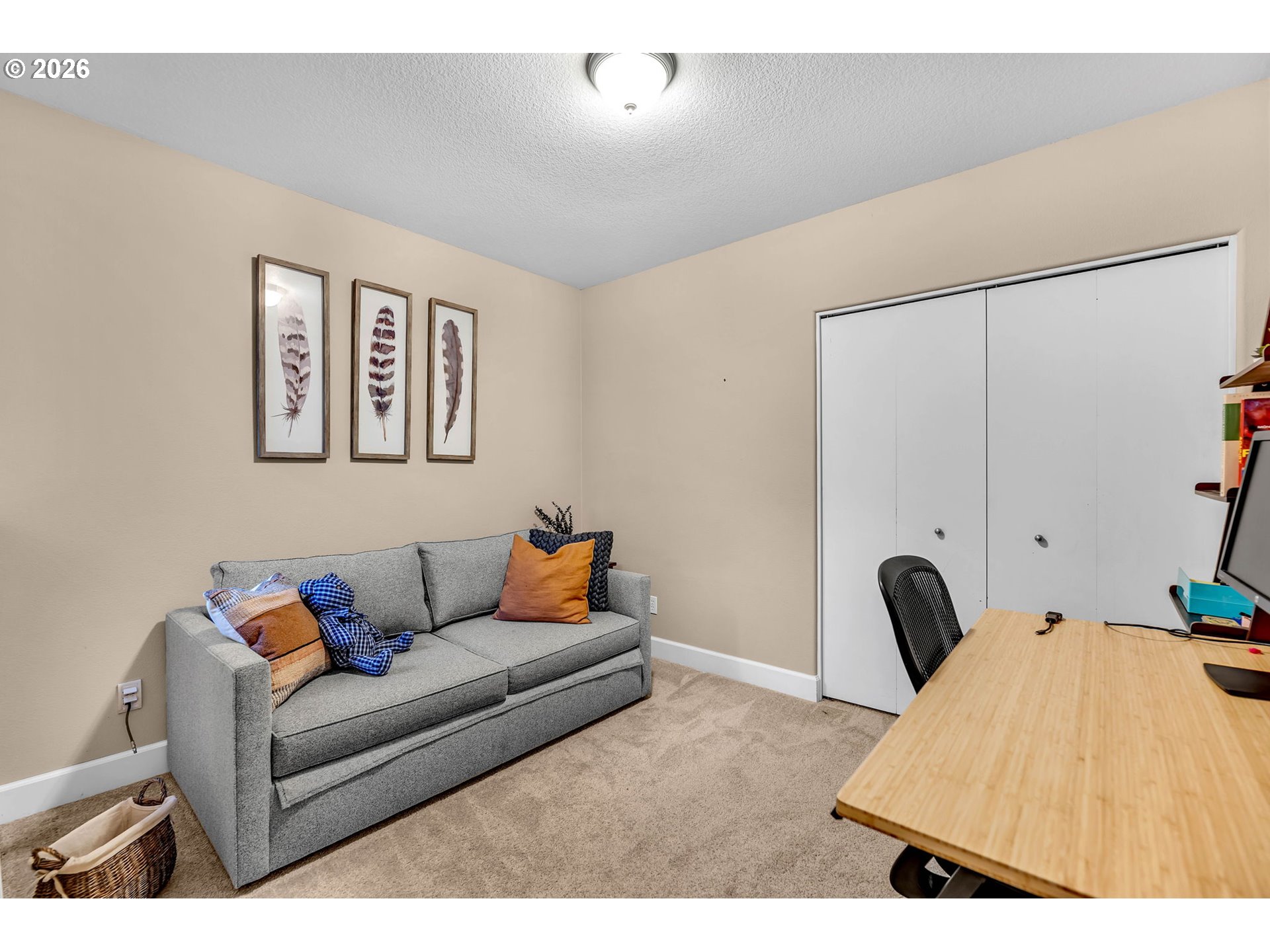 2974 Northwest Kennedy Court, Unit 1 Portland, OR 97229 - Photo 30 of 37 a living room with furniture and a couch