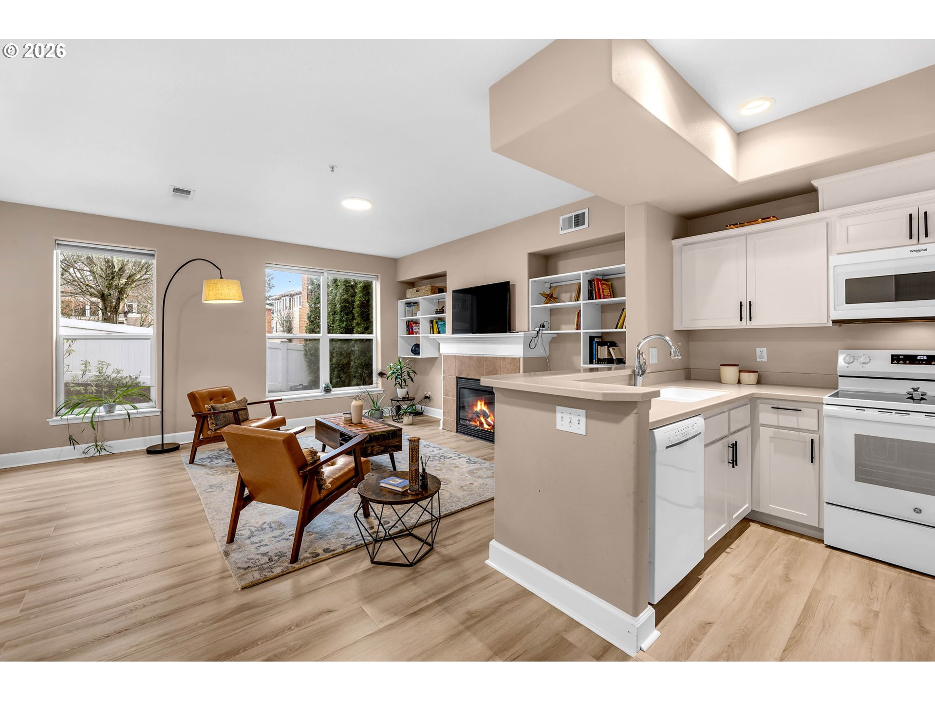 2974 Northwest Kennedy Court, Unit 1 Portland, OR 97229 - Photo 8 of 37 a kitchen with stainless steel appliances granite countertop a stove and a refrigerator