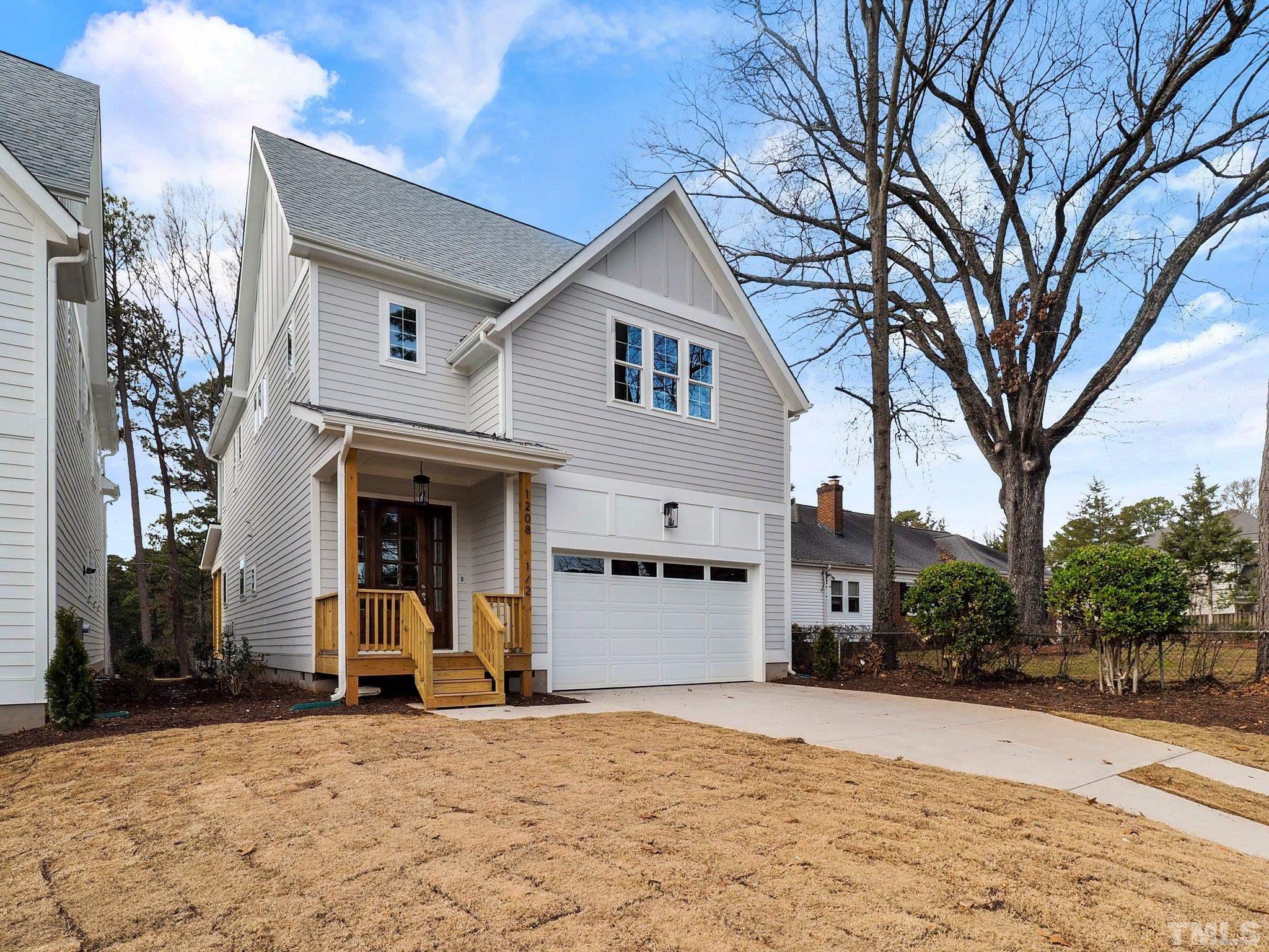 1210 Kent Road Raleigh, NC 27606 - Photo 1 of 30 a view of a white house with a large tree