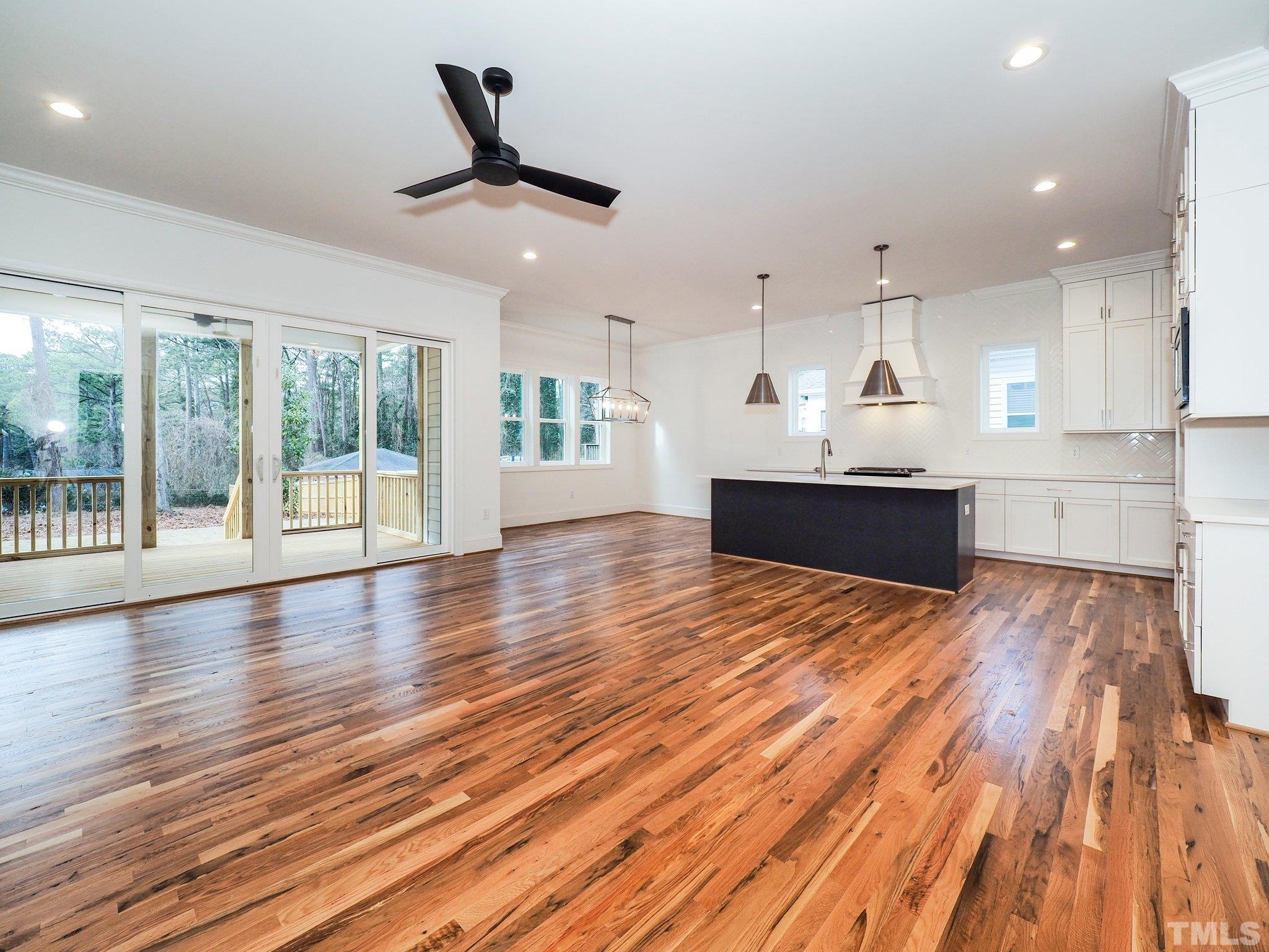 1210 Kent Road Raleigh, NC 27606 - Photo 17 of 30 an empty room with wooden floor and windows