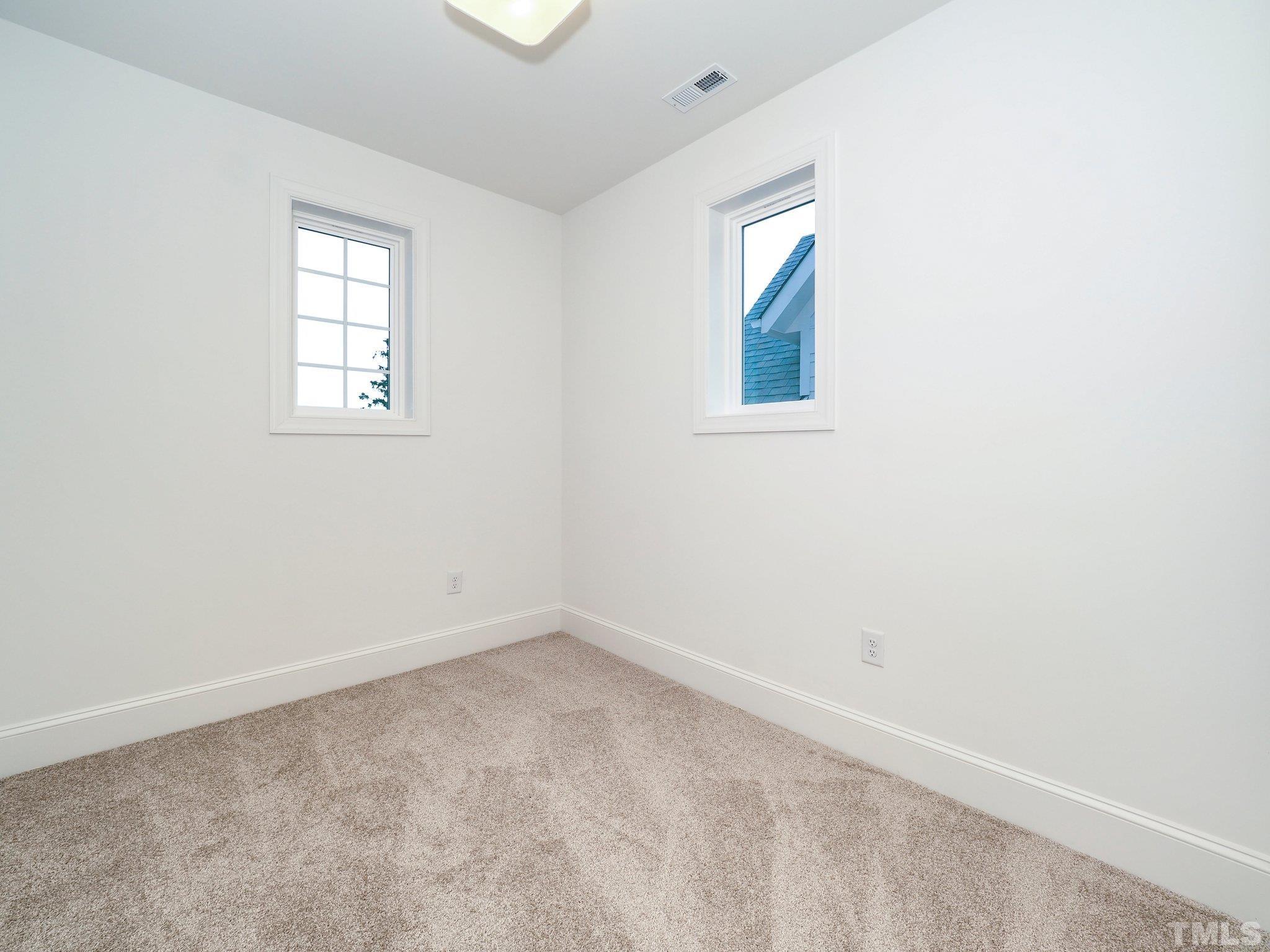 1210 Kent Road Raleigh, NC 27606 - Photo 18 of 30 an empty room with windows