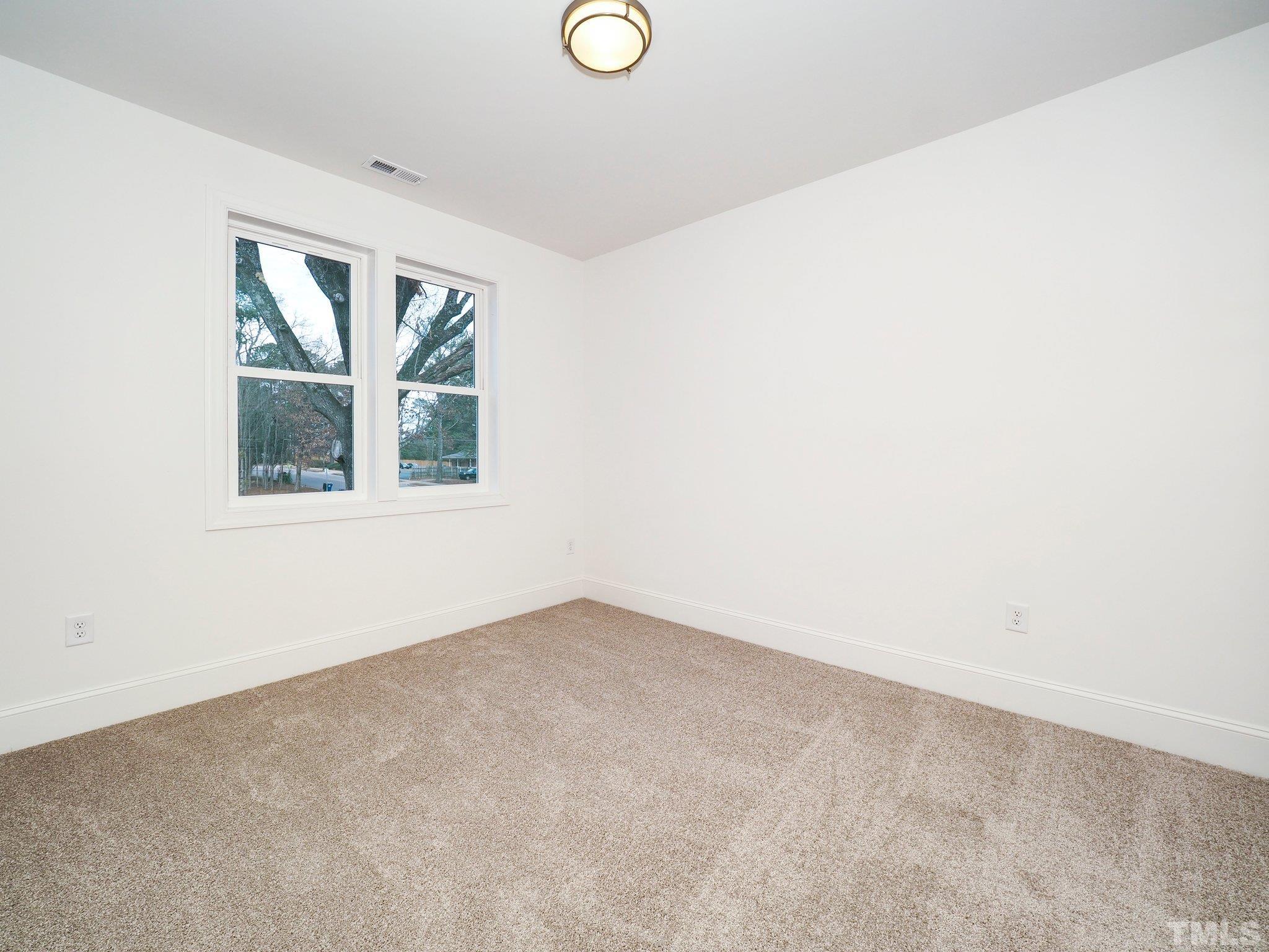 1210 Kent Road Raleigh, NC 27606 - Photo 20 of 30 an empty room with a window