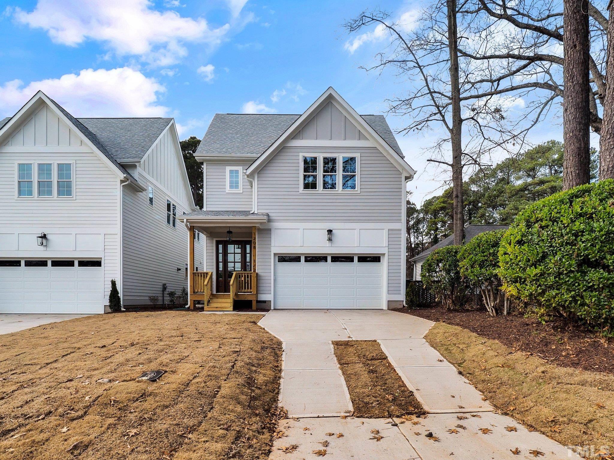 1210 Kent Road Raleigh, NC 27606 - Photo 2 of 30 a front view of a house with a yard
