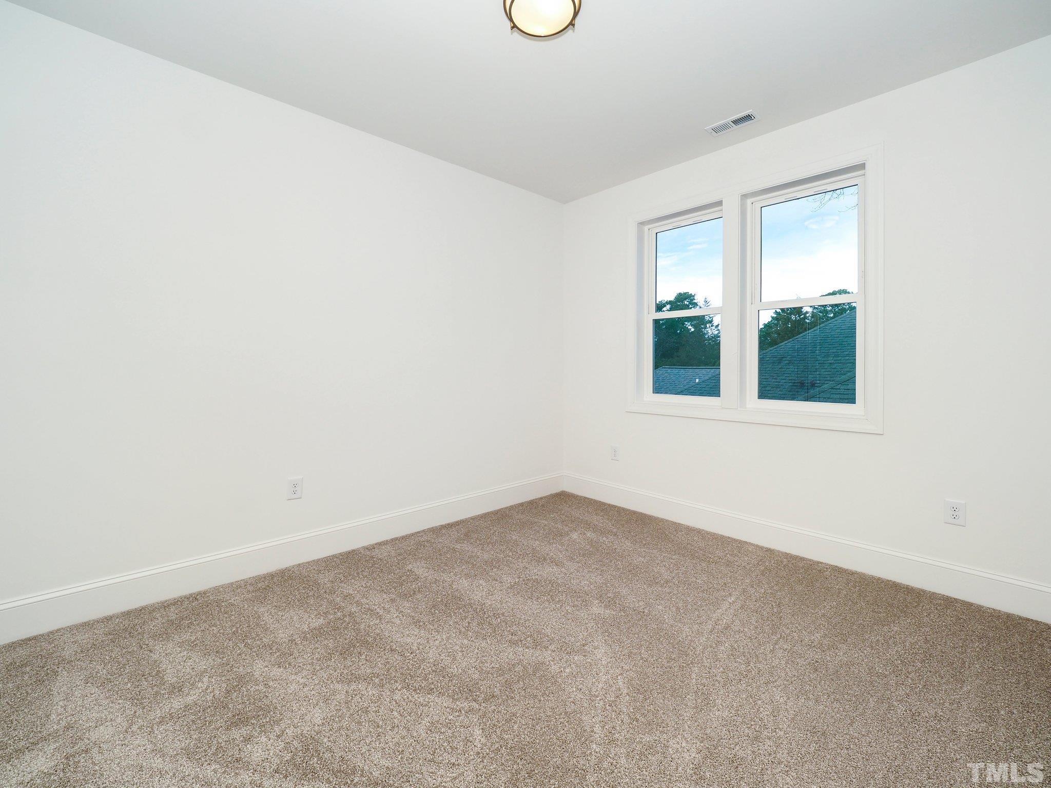 1210 Kent Road Raleigh, NC 27606 - Photo 22 of 30 an empty room with window