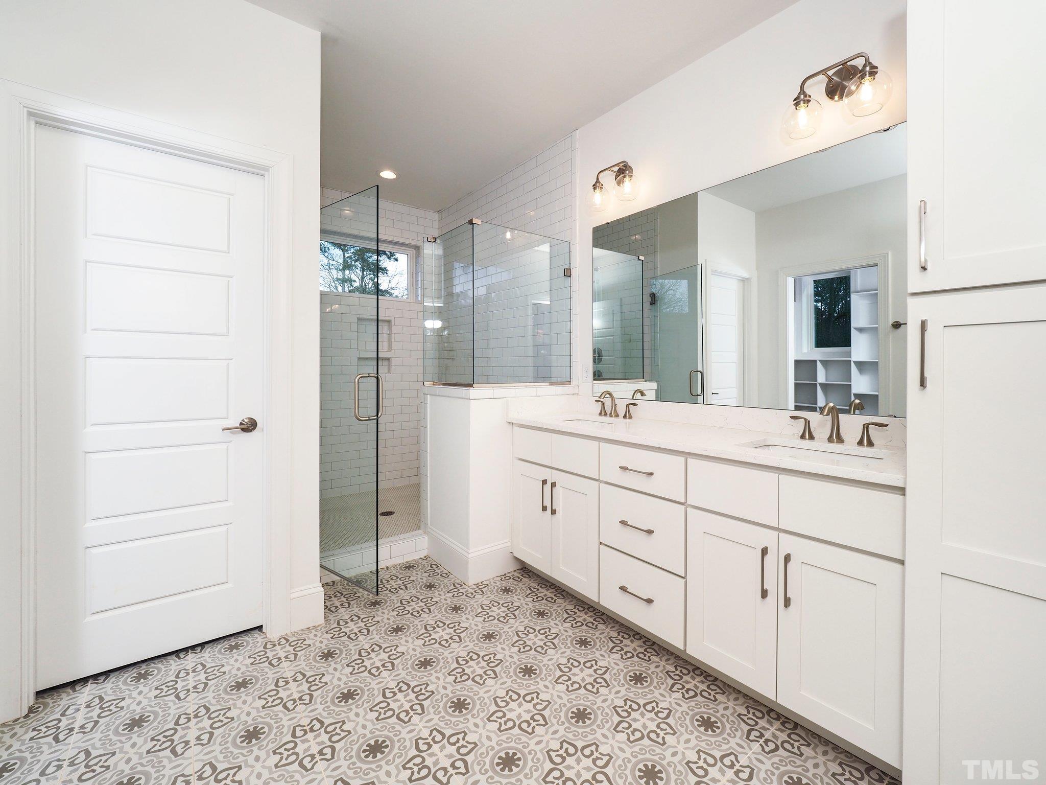 1210 Kent Road Raleigh, NC 27606 - Photo 24 of 30 a spacious bathroom with a double vanity sink mirror and double