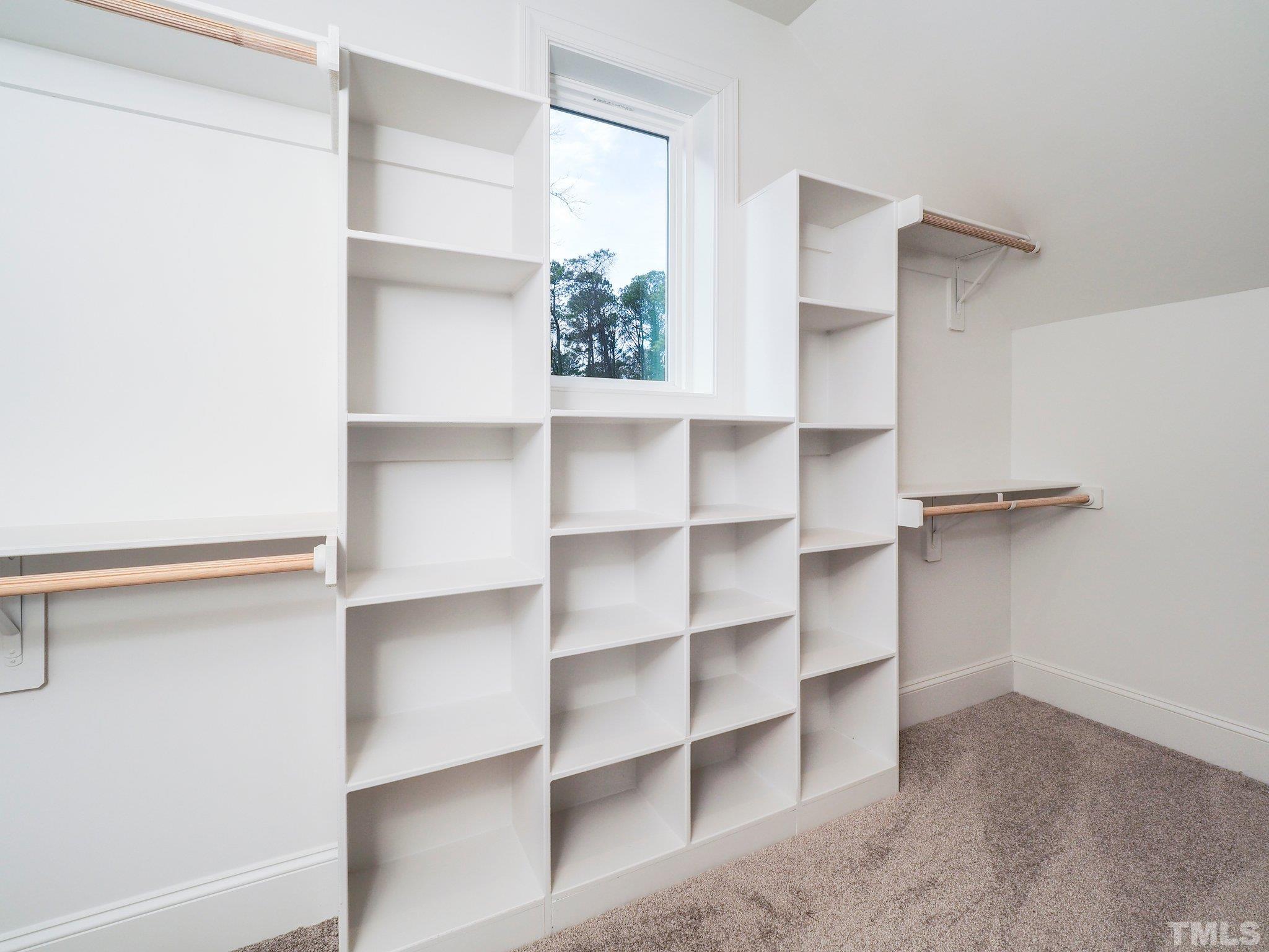 1210 Kent Road Raleigh, NC 27606 - Photo 25 of 30 a view of walk in closet with empty racks