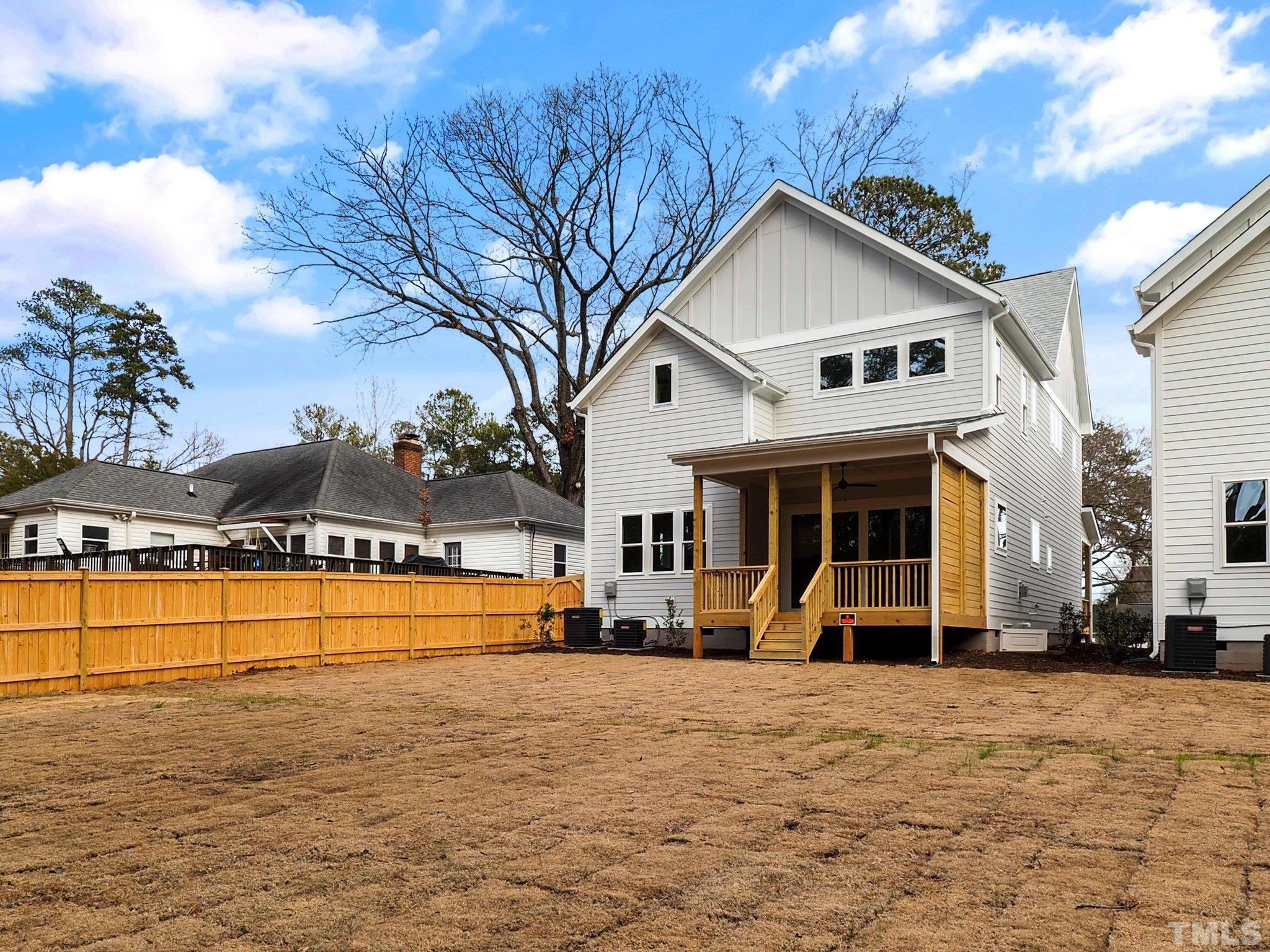 1210 Kent Road Raleigh, NC 27606 - Photo 27 of 30 a view of a white house with swimming pool lawn chairs and a barbeque