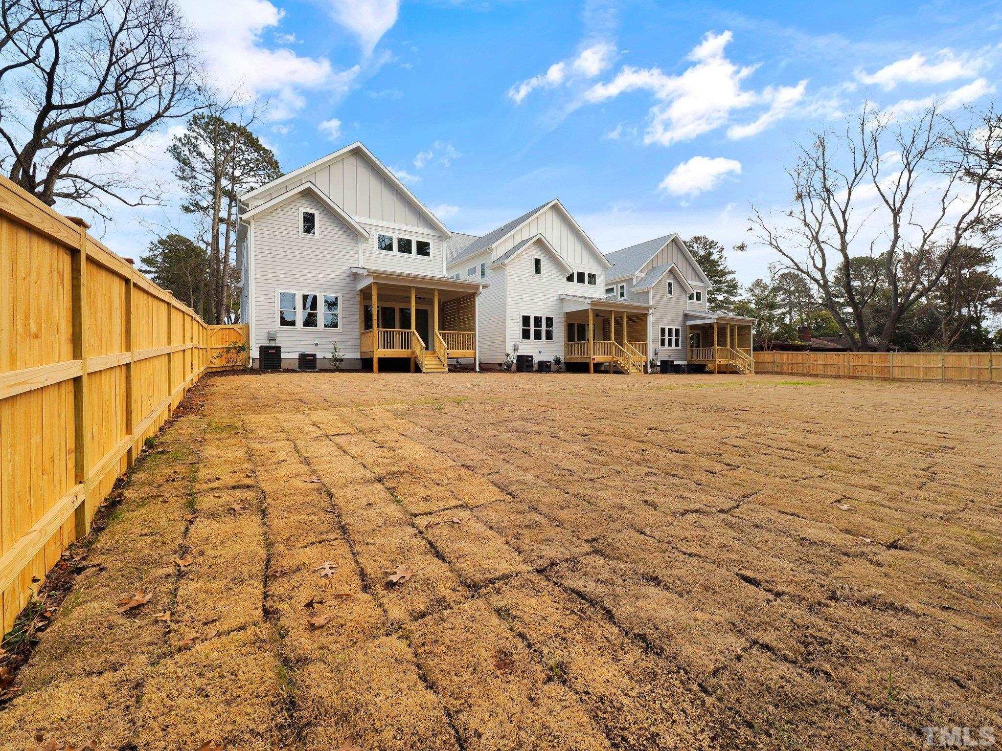 1210 Kent Road Raleigh, NC 27606 - Photo 29 of 30 a view of a white house with a yard