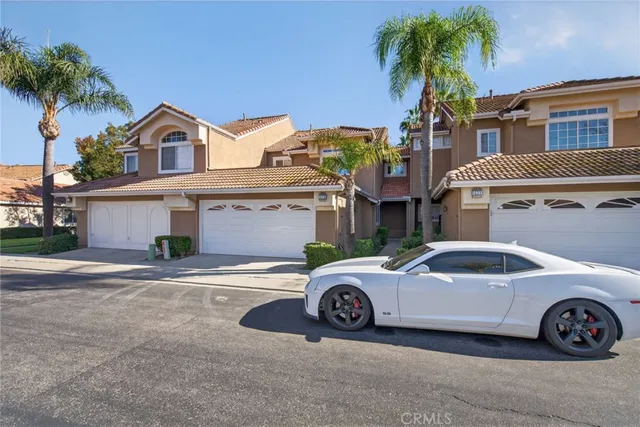 a view of a car parked in front of a house