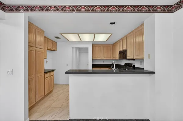 a kitchen with stainless steel appliances a sink a stove and a refrigerator
