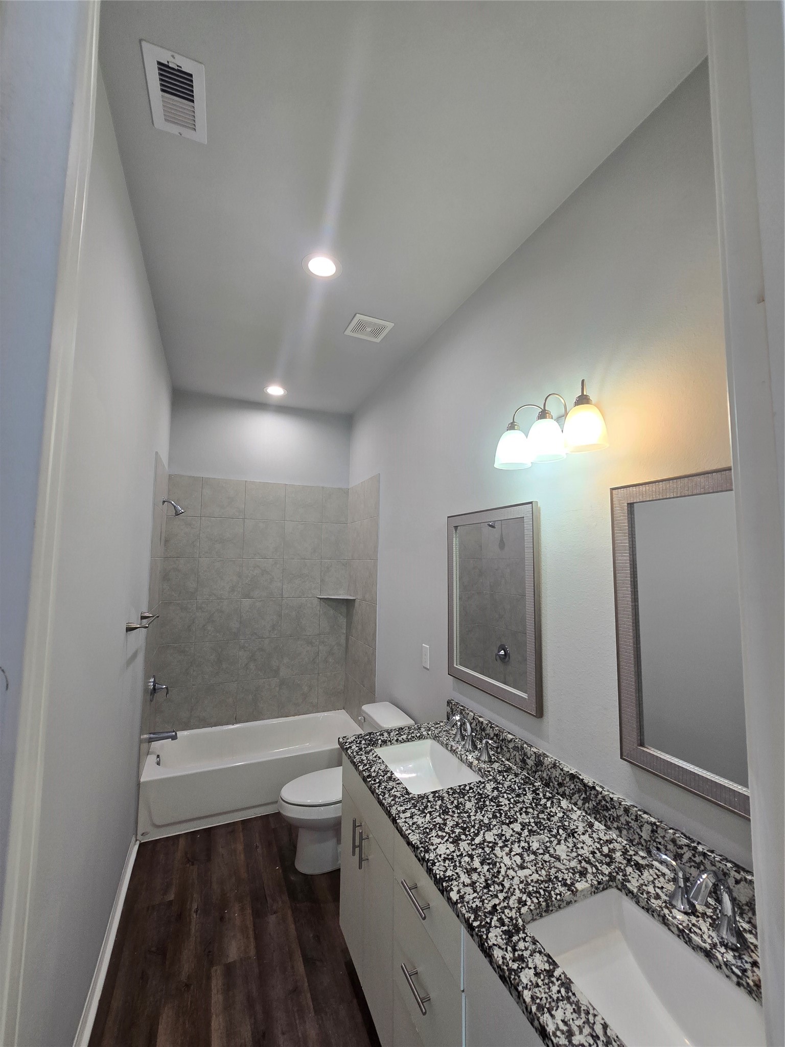 4902 Paradigm Ln Spring Spring, TX 77379 - Photo 18 of 24 a bathroom with a granite countertop sink a toilet and shower
