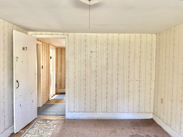 a view of a room with a wooden walls