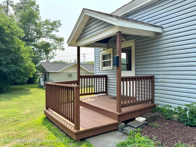 a view of a porch with a yard