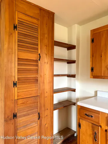 a kitchen with a refrigerator and cabinets