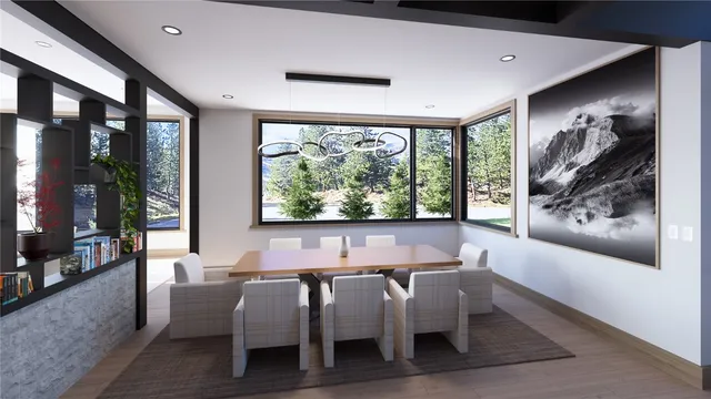 a dining room with furniture and a large window