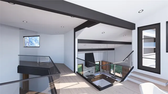 a living room with chairs and a table