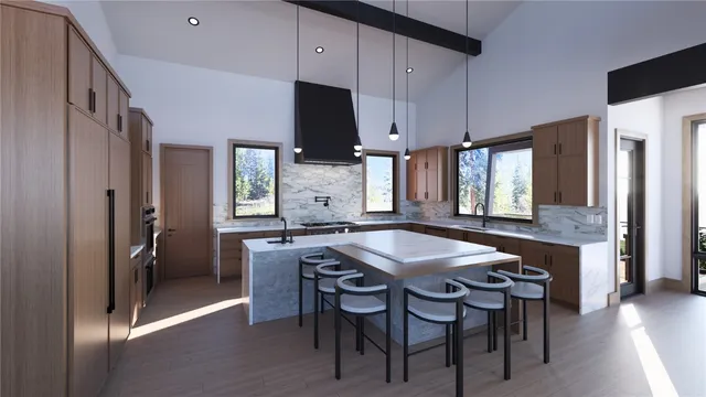 a kitchen with a table chairs refrigerator and microwave