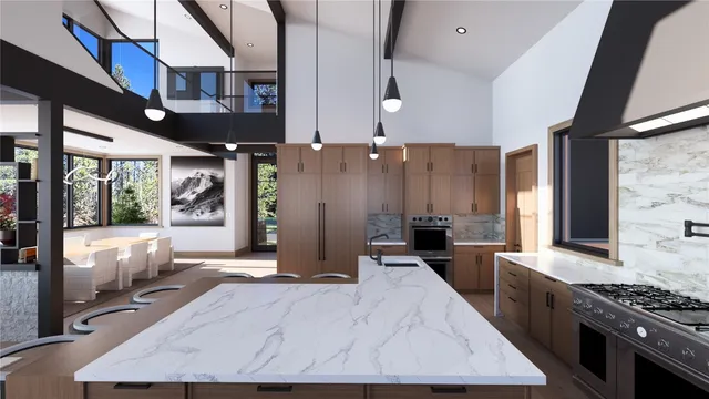 a large kitchen with stainless steel appliances a large counter top
