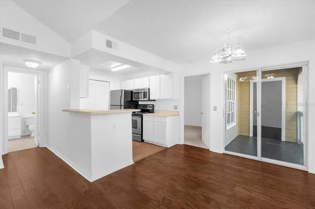 a view of kitchen with wooden floor