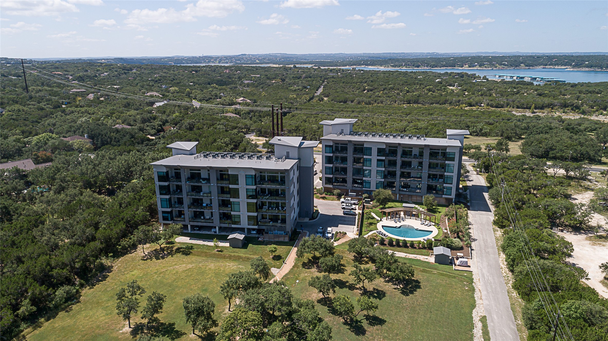 5921 Hiline Road, Unit 2403 Austin, TX 78734 - Photo 30 of 35 Aerial view of Waterfall condo buildings, private community pool and park.