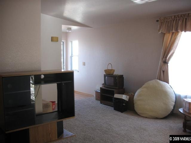 6752 Peppermint Court Reno, NV 89506 - Photo 5 of 9 a room with a table and a fireplace