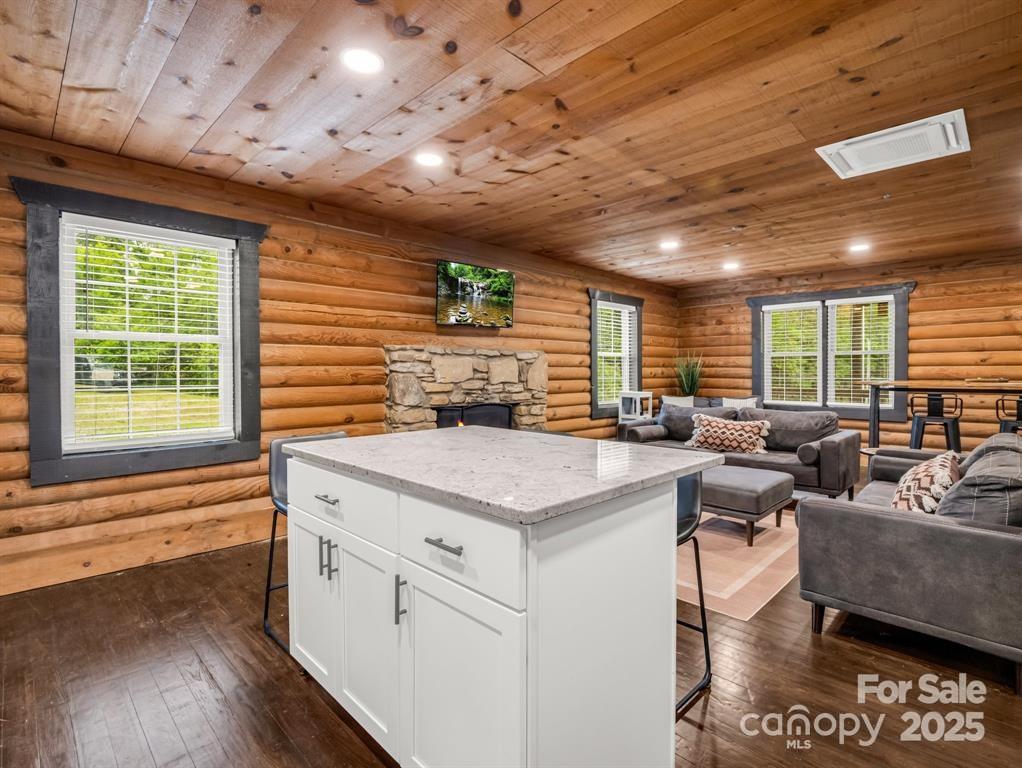 112 Bills Creek Road Lake Lure, NC 28746 - Photo 14 of 42 a open kitchen with stainless steel appliances granite countertop sink stove and wooden floor