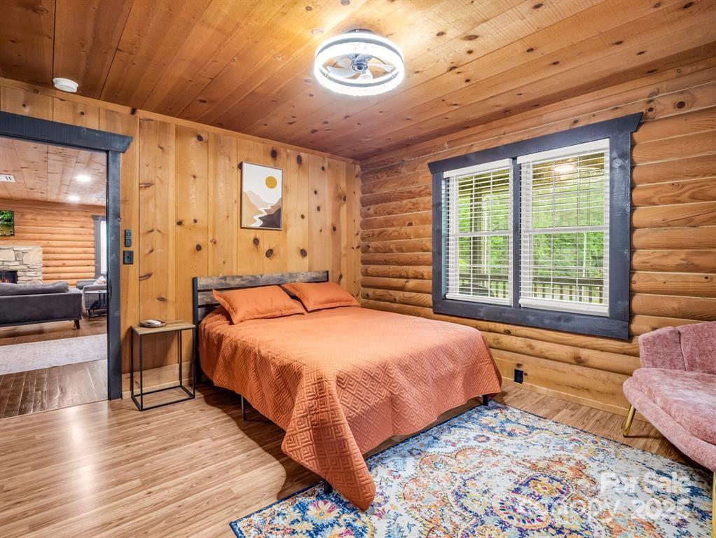 112 Bills Creek Road Lake Lure, NC 28746 - Photo 17 of 42 a bedroom with a bed and a window