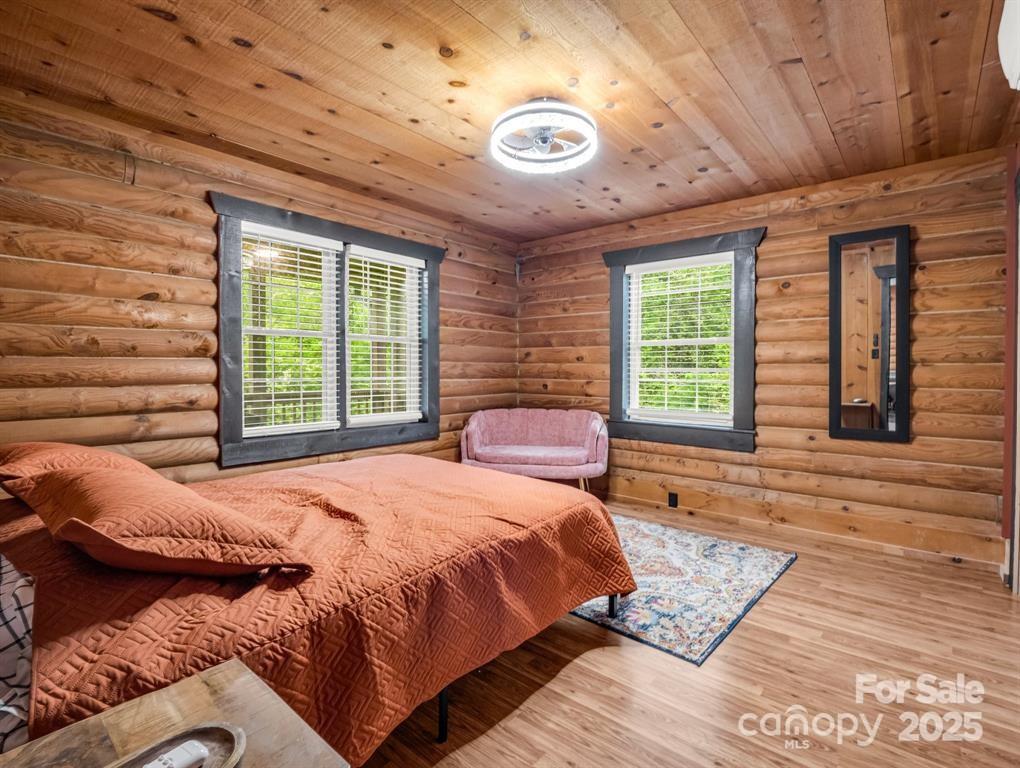 112 Bills Creek Road Lake Lure, NC 28746 - Photo 18 of 42 a bedroom with furniture and windows