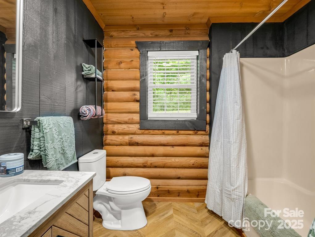 112 Bills Creek Road Lake Lure, NC 28746 - Photo 19 of 42 a bathroom with a toilet and a sink