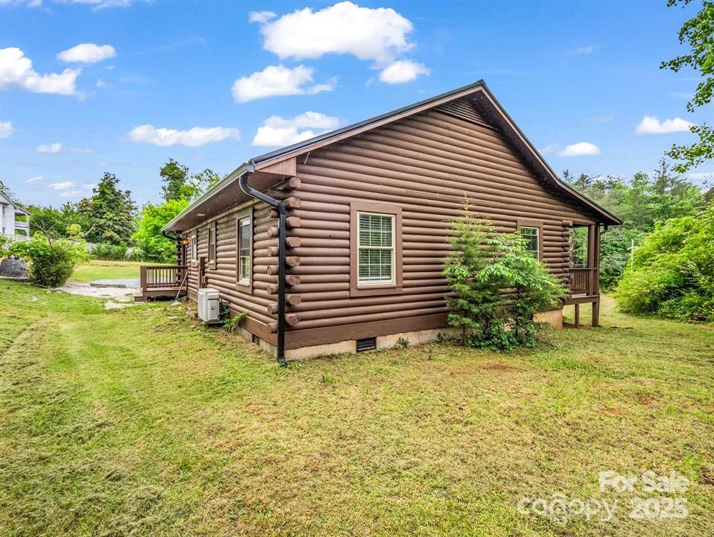 112 Bills Creek Road Lake Lure, NC 28746 - Photo 27 of 42 a view of a house with a yard
