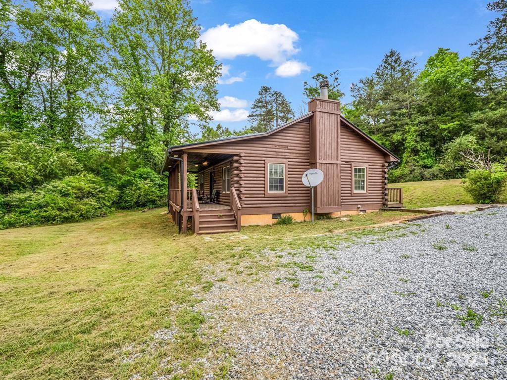 112 Bills Creek Road Lake Lure, NC 28746 - Photo 29 of 42 a view of a house with backyard and garden