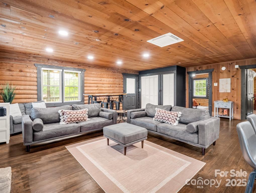 112 Bills Creek Road Lake Lure, NC 28746 - Photo 8 of 42 a living room with furniture and a large window