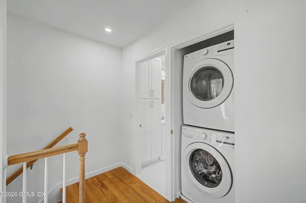 a view of a hallway with washer and dryer
