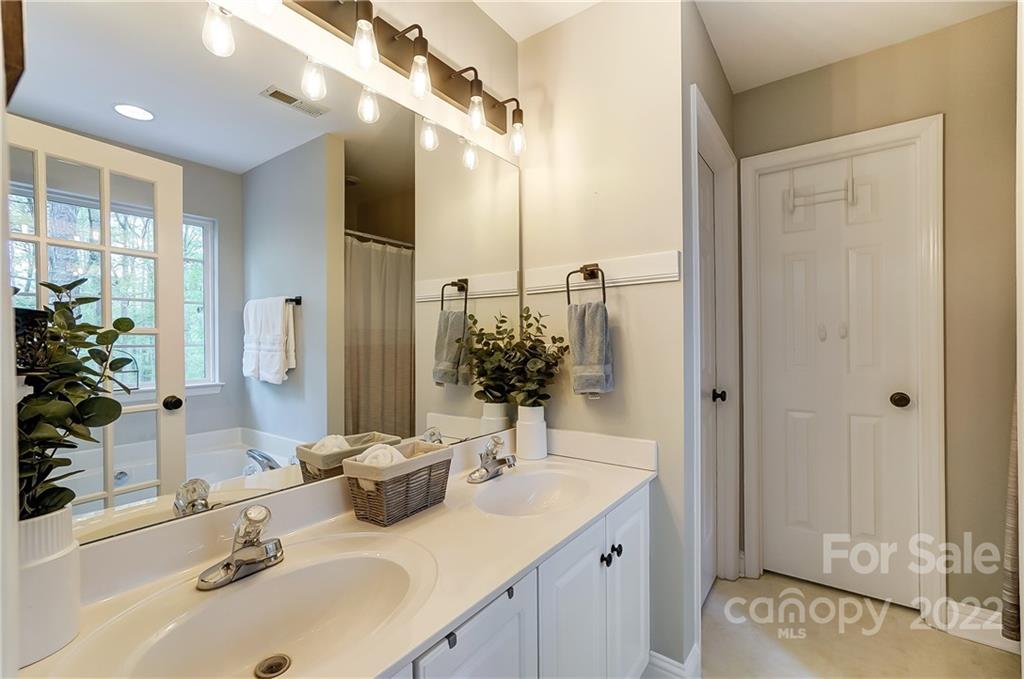 917 Potter Road Monroe, NC 28110 - Photo 13 of 25 a bathroom with a sink and a mirror