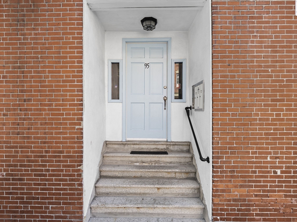 95 Florida Street, Unit 2 Boston, MA 02124 - Photo 25 of 29 a view of a staircase with white walls