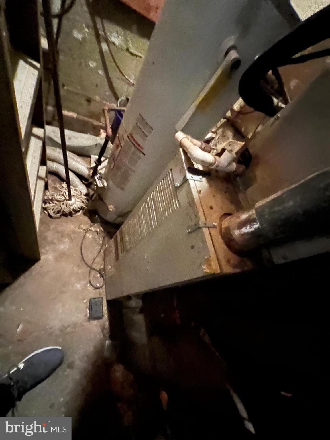 519 Cherry Hill Road Baltimore, MD 21225 - Photo 11 of 20 a picture of water heater room