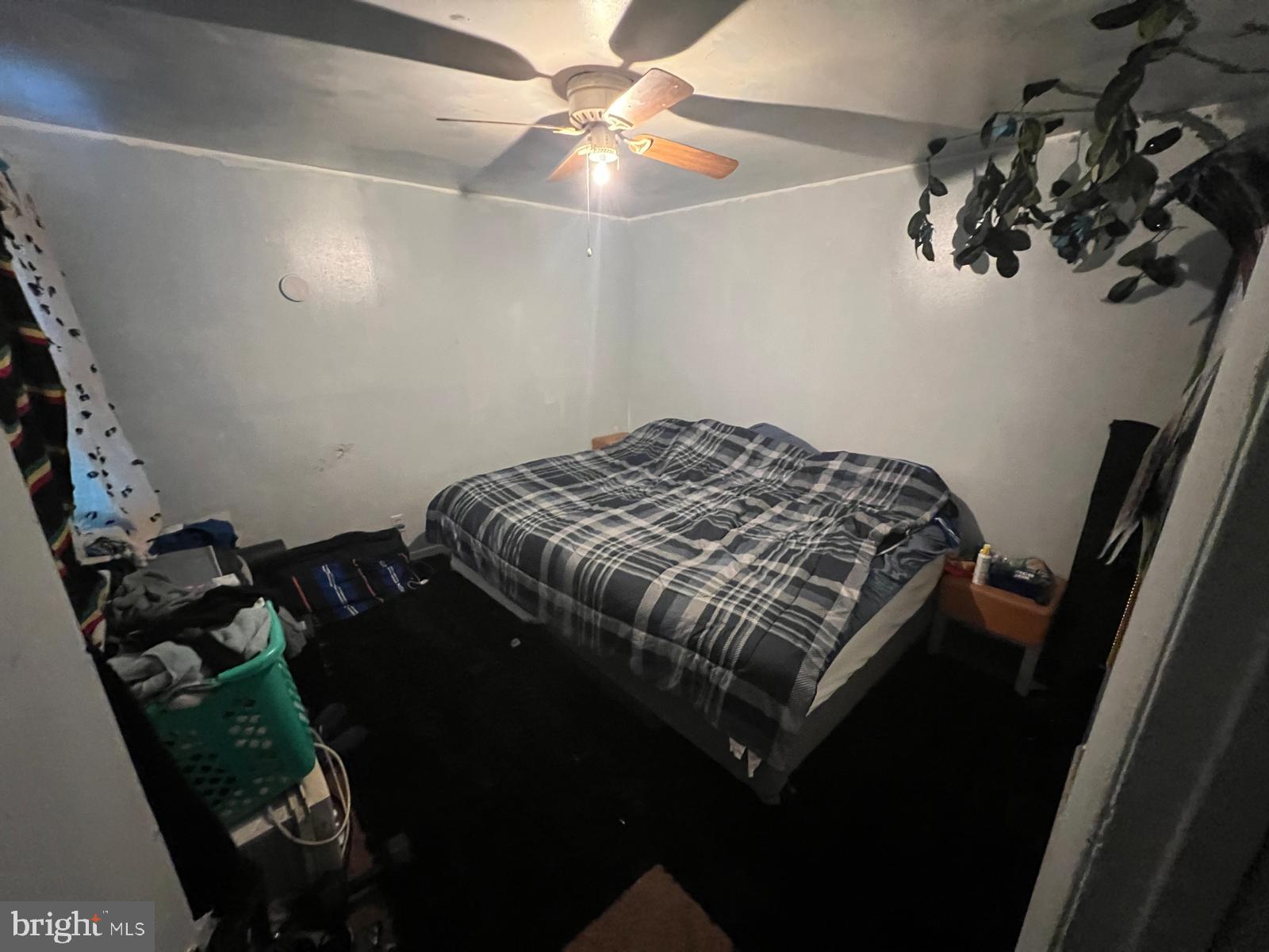 519 Cherry Hill Road Baltimore, MD 21225 - Photo 16 of 20 a bed sitting in a bedroom next to a window