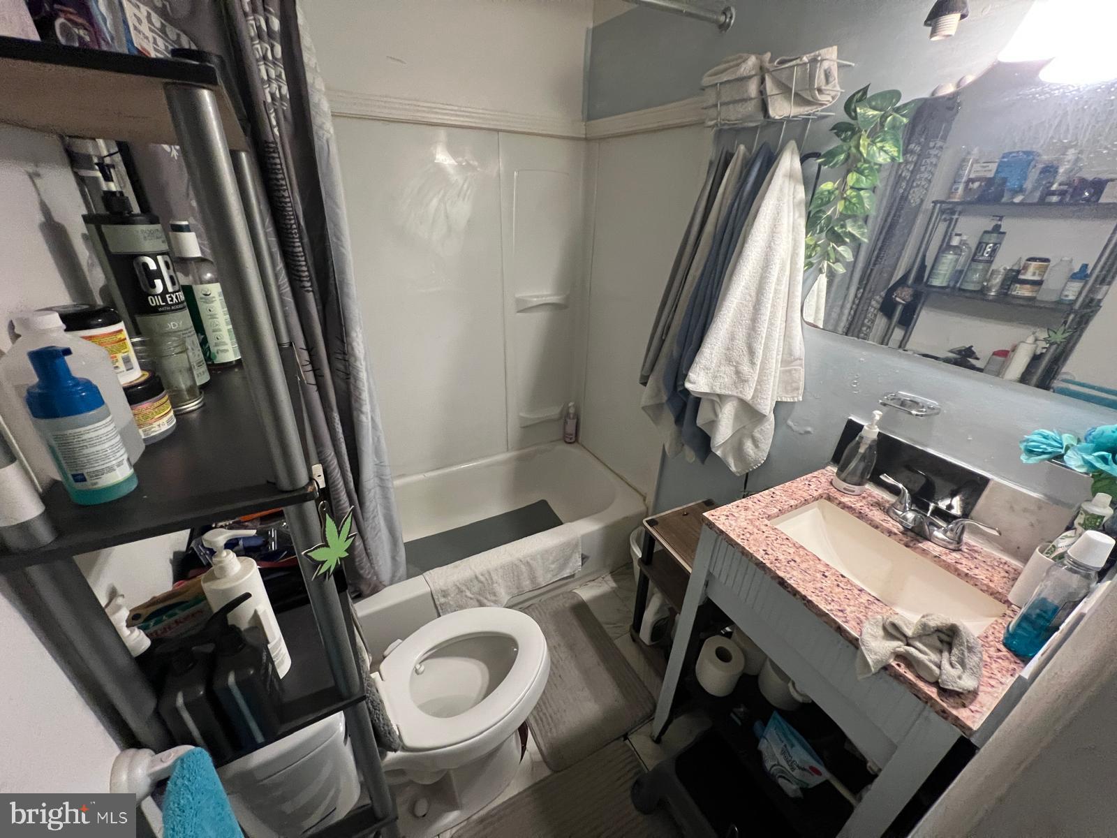 519 Cherry Hill Road Baltimore, MD 21225 - Photo 17 of 20 a bathroom with a sink and a mirror