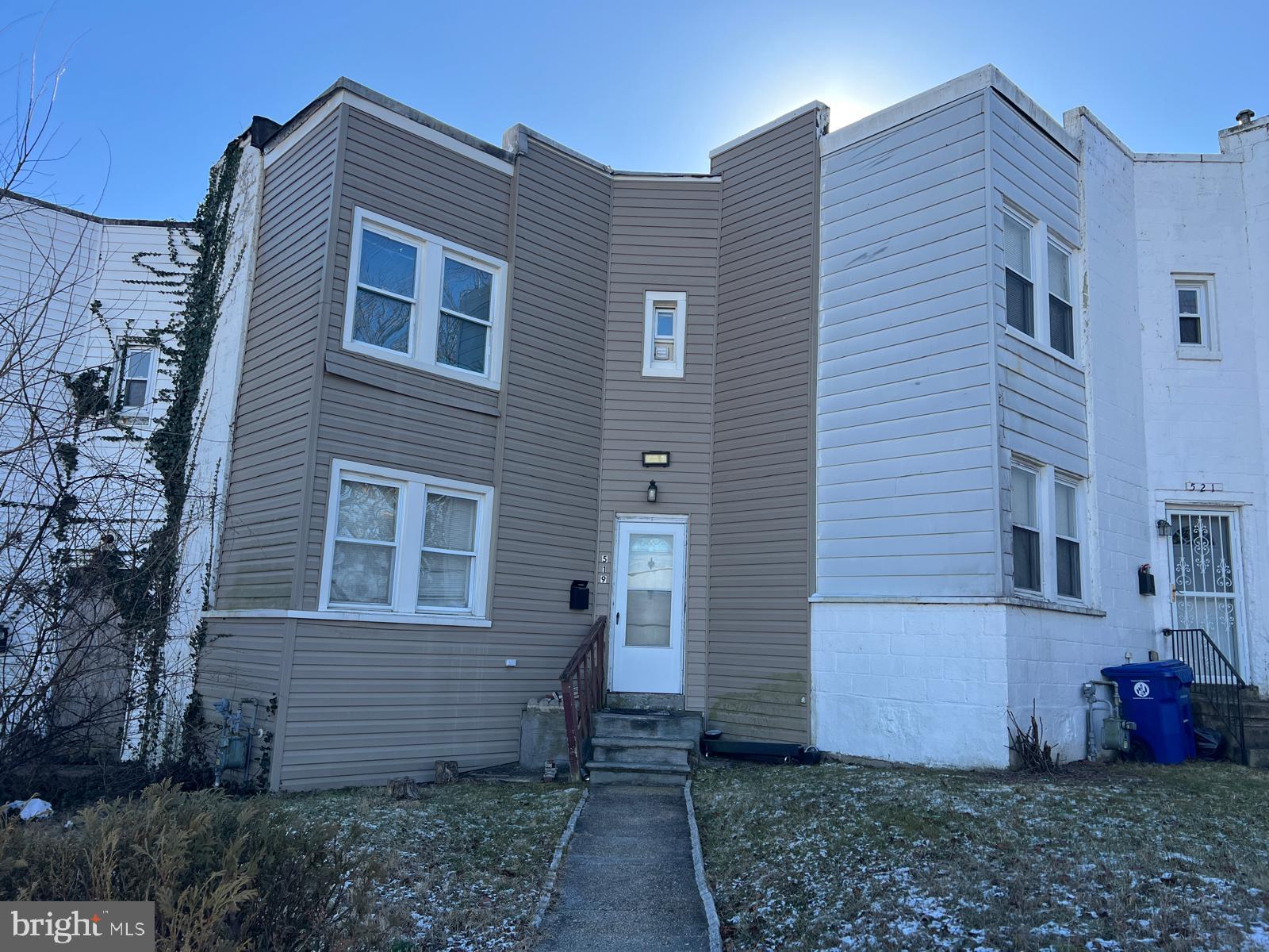 519 Cherry Hill Road Baltimore, MD 21225 - Photo 19 of 20 a view of a house with a yard