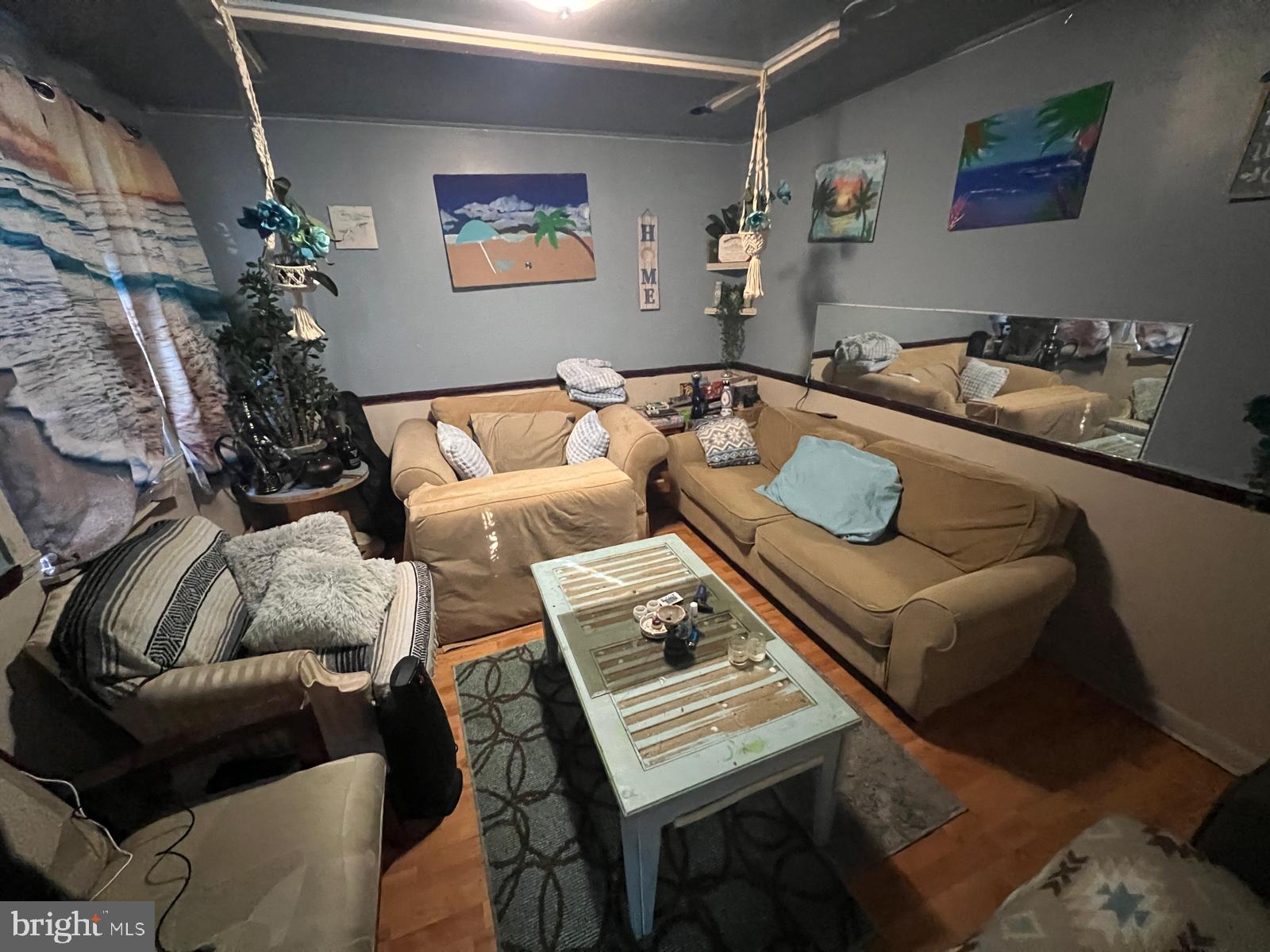 519 Cherry Hill Road Baltimore, MD 21225 - Photo 5 of 20 a living room with furniture and a rug