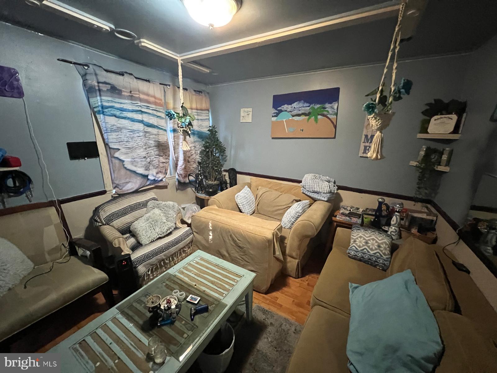 519 Cherry Hill Road Baltimore, MD 21225 - Photo 6 of 20 a bedroom with furniture and a couch