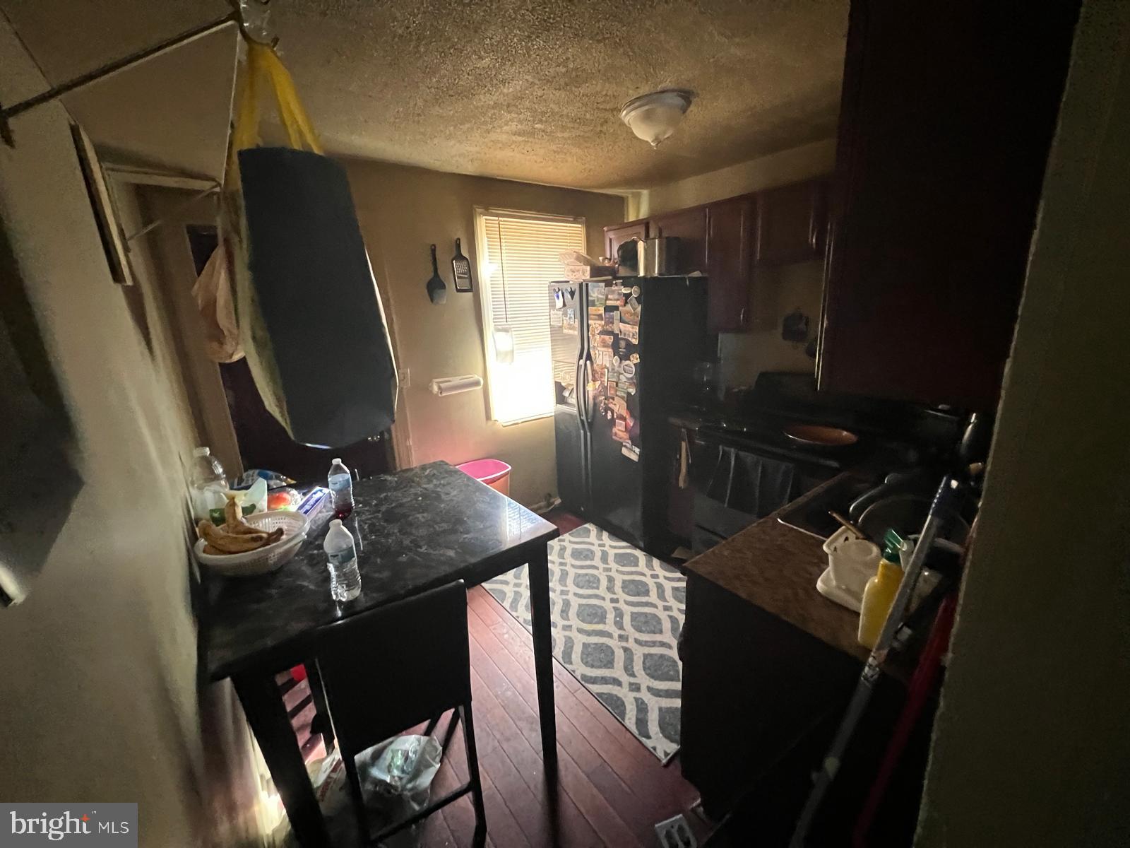 519 Cherry Hill Road Baltimore, MD 21225 - Photo 9 of 20 a kitchen with a sink appliances and cabinets