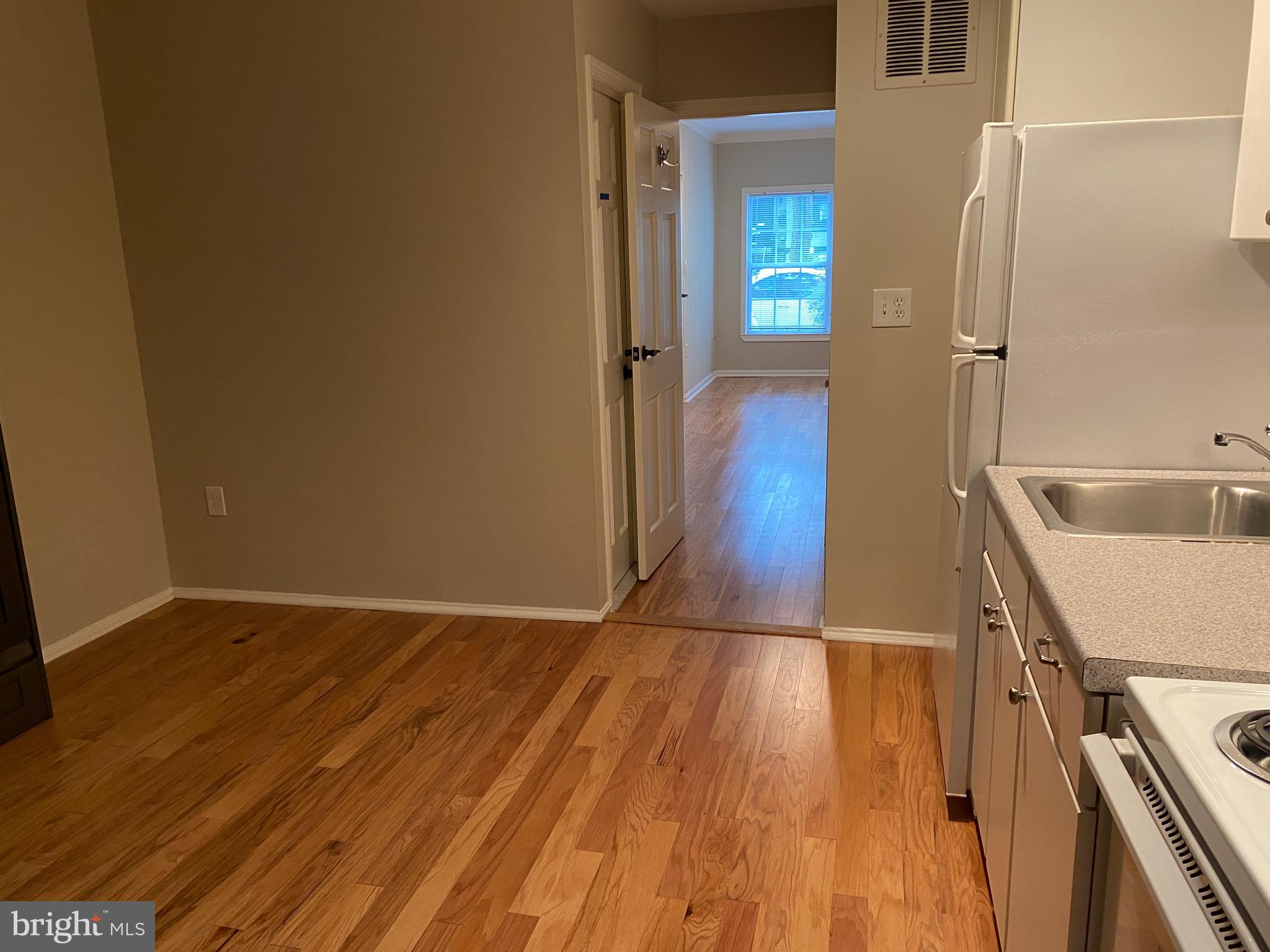 339 11th Street Southeast Washington, DC 20003 - Photo 6 of 39 a view of a kitchen from a hallway