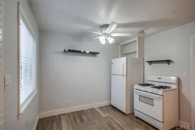 a view of kitchen and hallway with a stove