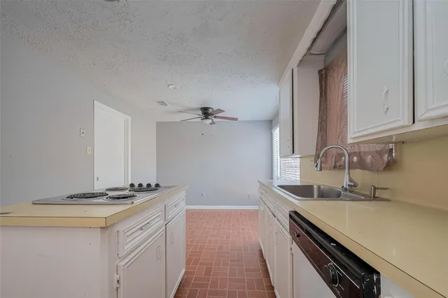a kitchen with a stove and a refrigerator