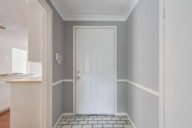 a view of empty room with wooden floor and ceiling fan
