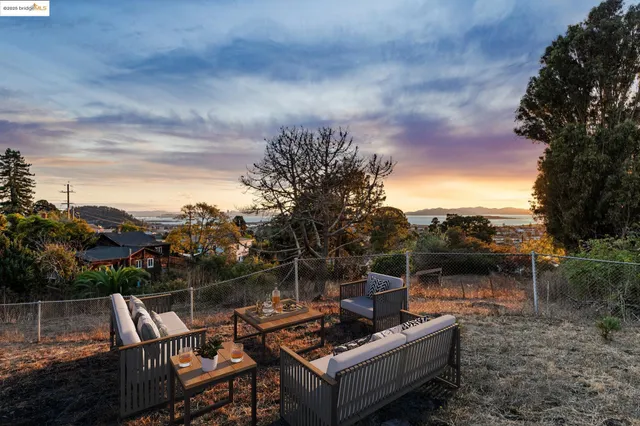 a view of a couches and lounge chairs in patio