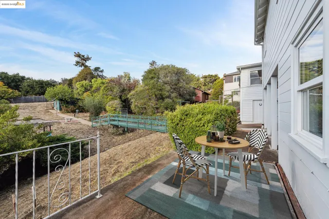 a view of a backyard with furniture