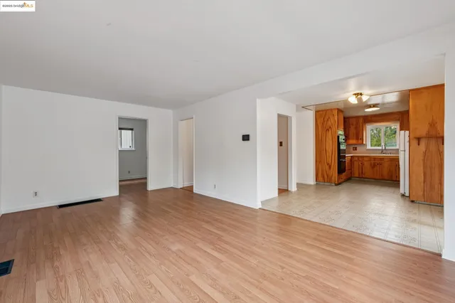 a kitchen with stainless steel appliances a sink dishwasher stove and cabinets